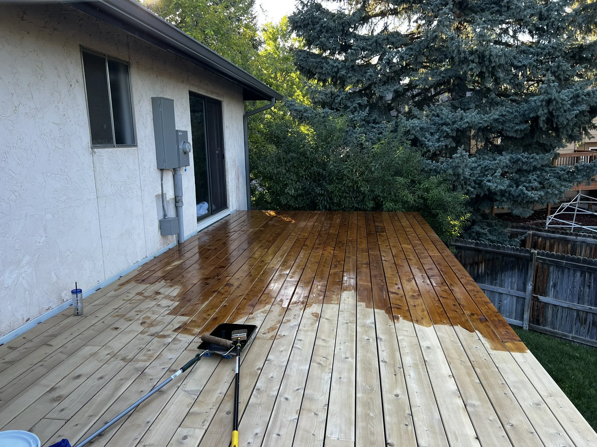 Deck staining in progress McHenry County IL